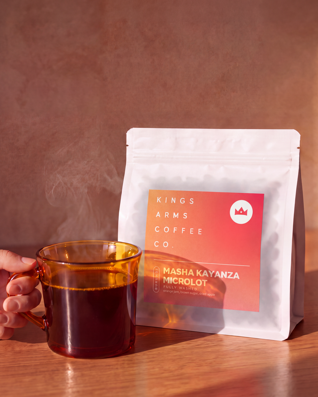 Burundi Masha Kayanza Microlot coffee bag with a brewed cup, styled